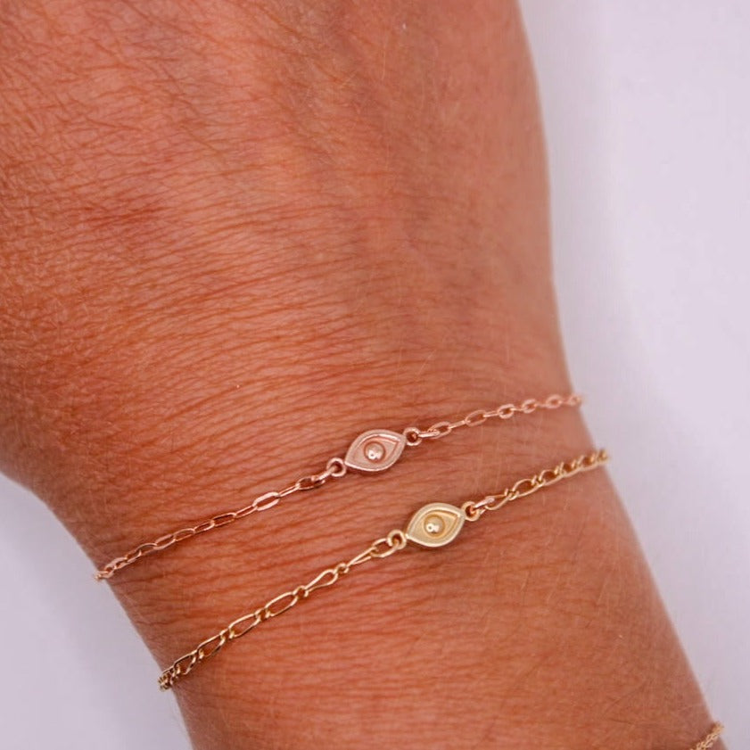 14k permanent bracelet with yellow gold and rose gold evil eye