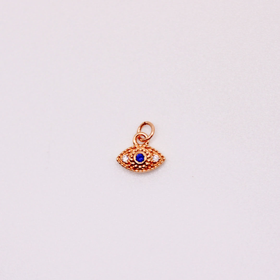 14k gold diamond and sapphire evil eye charm for permanent jewelry